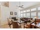 Bright living room featuring a fireplace, built-in cabinets, and large windows for natural light at 12212 Ashton Woods Ln, Raleigh, NC 27614