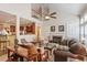 Open-concept living room boasts hardwood floors, fireplace, and views into the kitchen at 12212 Ashton Woods Ln, Raleigh, NC 27614