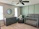 Neutral Bedroom featuring grey furniture, natural light, and modern decor at 123 Claystone Dr, Gibsonville, NC 27249
