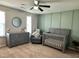 Bedroom with gray furniture set, modern accent wall, and a neutral color scheme at 123 Claystone Dr, Gibsonville, NC 27249