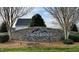 StoneRidge community entrance sign featuring a stone facade, landscaped plants, and mountain logo at 123 Claystone Dr, Gibsonville, NC 27249