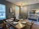 Formal dining room featuring an elegant table setting and contemporary decor at 123 Claystone Dr, Gibsonville, NC 27249