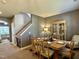 Traditional dining room showcasing a wood table with seating and a view into the living area at 123 Claystone Dr, Gibsonville, NC 27249