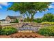 StoneRidge community entrance sign with landscaped grounds and community homes at 123 Claystone Dr, Gibsonville, NC 27249