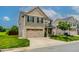 Well-maintained home showcases a manicured lawn, complemented by a neutral color palette at 123 Claystone Dr, Gibsonville, NC 27249