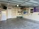 Well-maintained garage featuring shelving and storage, providing organized space for tools and equipment at 123 Claystone Dr, Gibsonville, NC 27249