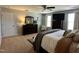 Spacious bedroom with a full bedroom set, large windows for natural light, and soft carpet at 123 Claystone Dr, Gibsonville, NC 27249