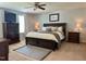 Bedroom featuring a comfortable bed, wooden furniture, neutral colors, and ample natural light at 123 Claystone Dr, Gibsonville, NC 27249