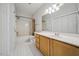 Bright bathroom with a single sink vanity and shower/tub combination at 1301 Durlain Dr # 103, Raleigh, NC 27614