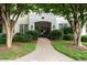 Welcoming entrance with lush landscaping leading to the front door at 1301 Durlain Dr # 103, Raleigh, NC 27614