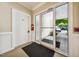 Well-lit entryway with secure door and vestibule leading to outdoor sidewalk at 1301 Durlain Dr # 103, Raleigh, NC 27614