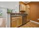 Kitchen featuring stainless steel appliances and convenient breakfast bar seating at 1301 Durlain Dr # 103, Raleigh, NC 27614