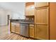 Kitchen with stainless steel appliances, sink, and light wood cabinets at 1301 Durlain Dr # 103, Raleigh, NC 27614