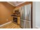 Well-lit kitchen featuring stainless steel appliances and wooden cabinetry at 1301 Durlain Dr # 103, Raleigh, NC 27614