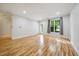 Large living room featuring wood flooring, bright windows, and neutral paint at 1301 Durlain Dr # 103, Raleigh, NC 27614