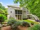 Expansive backyard with multiple levels, stone patio, waterfall, and lush landscaping at 1308 Woodgate Manor Ct, Raleigh, NC 27614