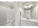 Bathroom with a single sink, tub/shower combination, and classic white fixtures at 1308 Woodgate Manor Ct, Raleigh, NC 27614