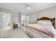 Bedroom featuring a bed, built-in desk, and an ensuite bathroom for added convenience at 1308 Woodgate Manor Ct, Raleigh, NC 27614