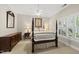 Comfortable bedroom featuring a four-poster bed, ceiling fan, and plantation shutters at 1308 Woodgate Manor Ct, Raleigh, NC 27614
