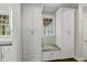 Charming built-in cabinetry features a window seat with designer patterned cushion and storage at 1308 Woodgate Manor Ct, Raleigh, NC 27614