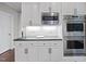 Modern kitchen features stainless steel appliances and granite countertops at 1308 Woodgate Manor Ct, Raleigh, NC 27614