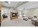 Inviting living room with a fireplace, plush carpeting, and comfortable furniture at 1308 Woodgate Manor Ct, Raleigh, NC 27614