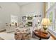 Inviting living room with a cozy fireplace, custom built-ins, and plenty of seating at 1308 Woodgate Manor Ct, Raleigh, NC 27614