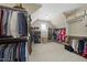 Spacious walk-in closet with ample shelving, hanging rods, and natural light at 1308 Woodgate Manor Ct, Raleigh, NC 27614