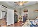 Bright bedroom offers hardwood floors, neutral walls, and access to additional rooms at 133 Marino Pl, Clayton, NC 27527