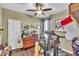 Comfortable bedroom with wooden floors, ceiling fan, and a variety of decorative items at 133 Marino Pl, Clayton, NC 27527