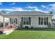 Well-maintained home with tidy landscaping and a cozy covered porch area at 133 Marino Pl, Clayton, NC 27527