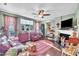 Cozy living room with hardwood floors, fireplace, and abundant natural light at 133 Marino Pl, Clayton, NC 27527