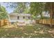 Back exterior view with patio seating and fenced backyard at 1408 Ida St, Durham, NC 27705