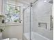 Modern bathroom with a glass enclosed shower and a niche for storage at 1408 Ida St, Durham, NC 27705