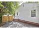 This exterior view showcases the home's features and yard at 1408 Ida St, Durham, NC 27705