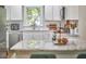 Bright kitchen with white cabinets, stainless steel appliances, and granite countertops at 1408 Ida St, Durham, NC 27705