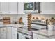 Modern kitchen with stainless steel appliances and white subway tile backsplash at 1408 Ida St, Durham, NC 27705