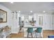 Bright kitchen featuring white cabinets, a granite island, and stainless steel appliances at 1408 Ida St, Durham, NC 27705