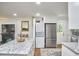 Open-concept kitchen featuring a large island, modern appliances, and sleek design at 1408 Ida St, Durham, NC 27705