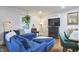 Comfortable living room with a plush blue sectional sofa and stylish decor at 1408 Ida St, Durham, NC 27705