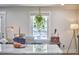 Bright living room with houseplant, comfortable couch, and neutral decor at 1408 Ida St, Durham, NC 27705