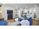 Bright living room with a comfortable blue sectional and an open view to the kitchen at 1408 Ida St, Durham, NC 27705