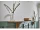 Stylish mud room with dark green wainscoting and hooks at 1408 Ida St, Durham, NC 27705
