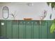 Stylish mud room with dark green wainscoting, hooks, and wood accents at 1408 Ida St, Durham, NC 27705