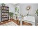 Cozy home office featuring a neutral color palette, natural light, and plant accents at 1408 Ida St, Durham, NC 27705