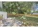 Backyard view with lush trees and outdoor patio furniture at 1408 Ida St, Durham, NC 27705