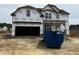 New two-story home with Tyvek wrap, covered entrance, and an attached two-car garage at 151 Retreat Run, Smithfield, NC 27577