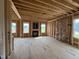 Framed living room showcasing a fireplace, large windows, and open layout, ready for customization at 151 Retreat Run, Smithfield, NC 27577