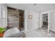 Renovated bathroom with tiled shower, tub and view into main bedroom area at 1541 Shadylawn Dr, Burlington, NC 27215