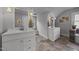 Bright bathroom featuring dual vanities, natural light, and neutral color scheme at 1541 Shadylawn Dr, Burlington, NC 27215
